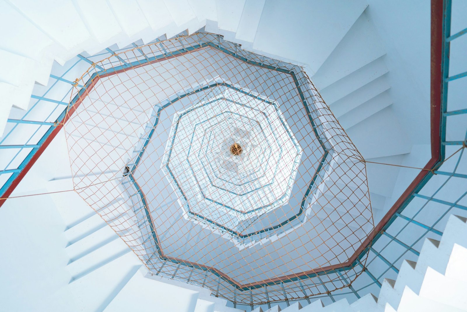 a view of a spiral staircase from below