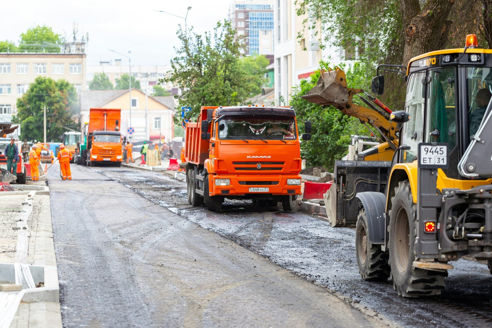 orange truck on road during daytime